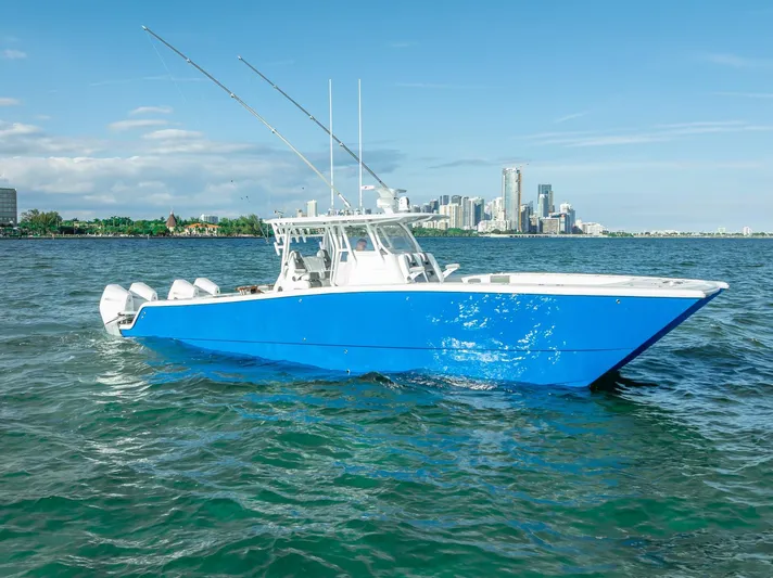  Yacht Photos Pics 2021 Freeman 37 boat on water with city skyline in background.