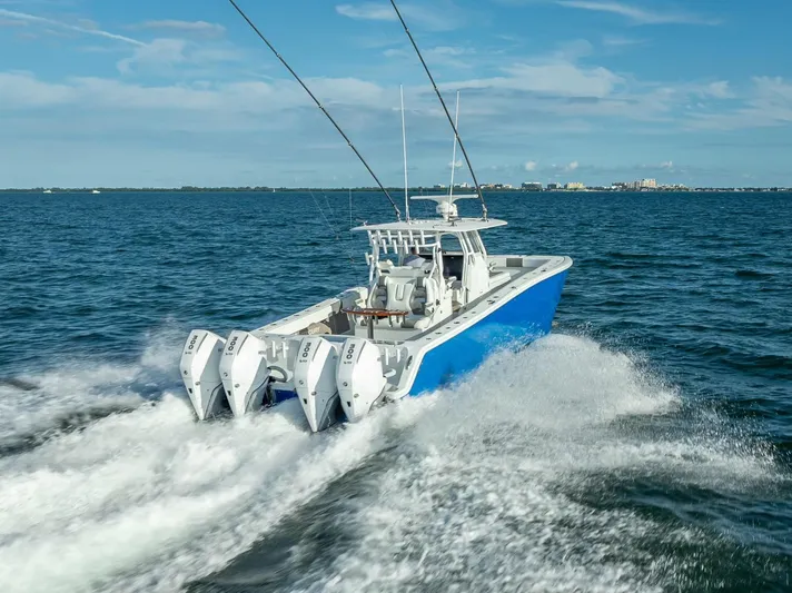  Yacht Photos Pics Freeman 37 boat, 2021 model, cruising on open water with four engines.