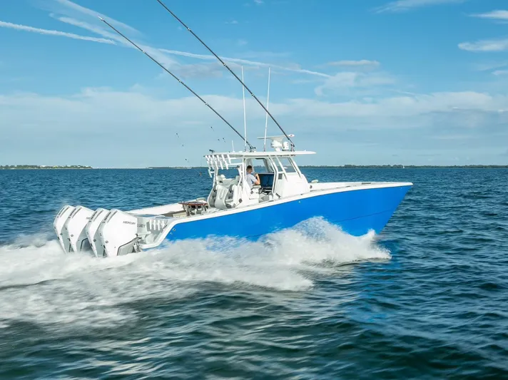  Yacht Photos Pics Freeman 37 boat cruising on open water, 2021 model, blue hull, clear sky.