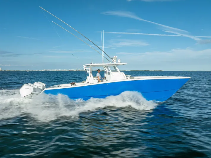  Yacht Photos Pics 2021 Freeman 37 boat cruising on open water under clear blue skies.