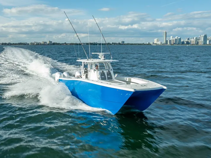  Yacht Photos Pics 2021 Freeman 37 boat cruising on open water near city skyline.