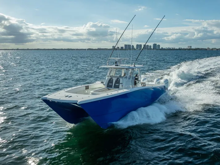  Yacht Photos Pics 2021 Freeman 37 boat cruising on open water under a partly cloudy sky.