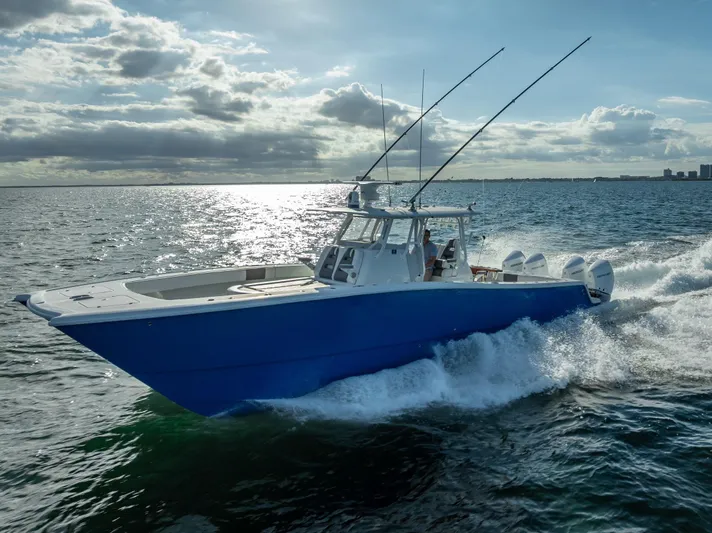  Yacht Photos Pics 2021 Freeman 37 boat cruising on open water under a cloudy sky.