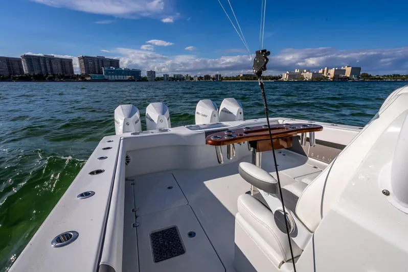  Yacht Photos Pics Freeman 37 boat, 2021 model, with four engines, on a sunny day near city skyline.