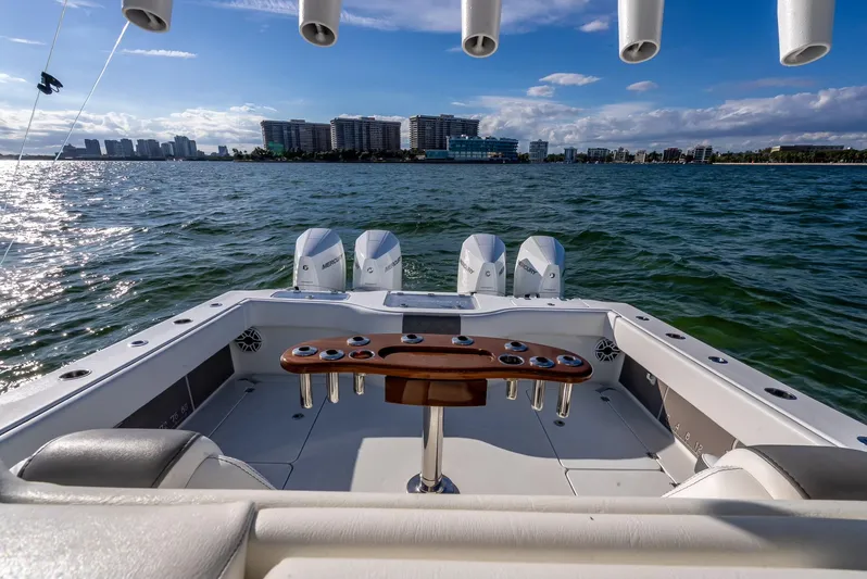  Yacht Photos Pics 2021 Freeman 37 boat with quad engines, ocean view, and city skyline in the background.