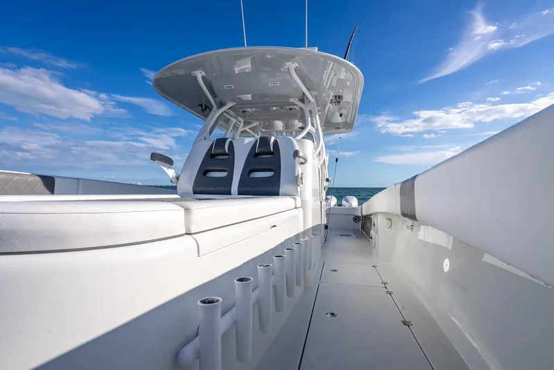  Yacht Photos Pics 2021 Freeman 37 boat with sleek design and spacious deck under a clear blue sky.