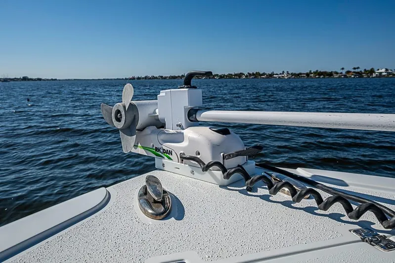  Yacht Photos Pics 2021 Yellowfin 32 Offshore boat with trolling motor on calm water.