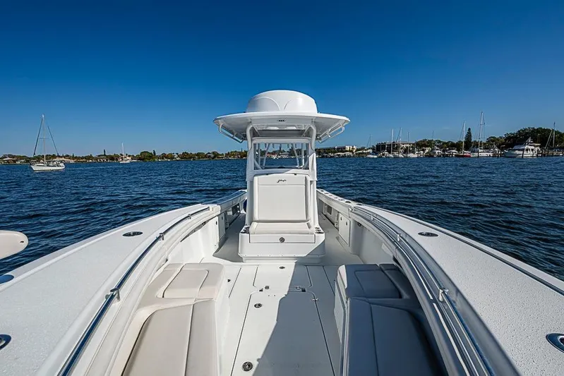  Yacht Photos Pics 2021 Yellowfin 32 Offshore boat on calm water with clear blue sky.