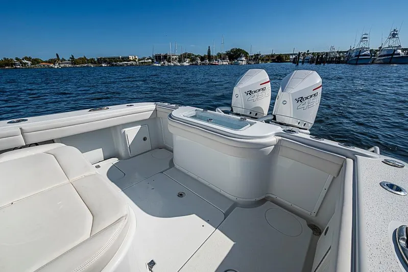  Yacht Photos Pics 2021 Yellowfin 32 Offshore boat with twin outboard engines on calm water.