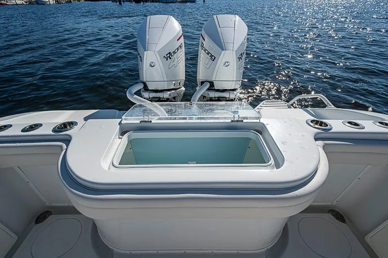  Yacht Photos Pics 2021 Yellowfin 32 Offshore boat with twin outboard engines on water.