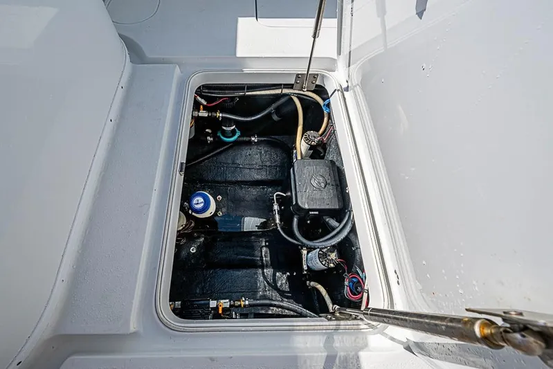  Yacht Photos Pics 2021 Yellowfin 32 Offshore boat compartment with visible wiring and components.