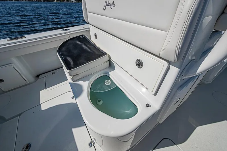  Yacht Photos Pics 2021 Yellowfin 32 Offshore boat interior with livewell and seating.