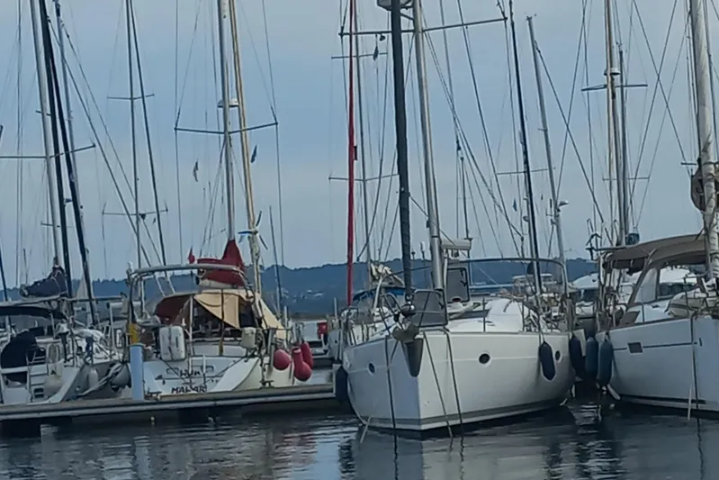  Yacht Photos Pics Sailboats docked at a marina, featuring a 2005 Elan Impression 434.