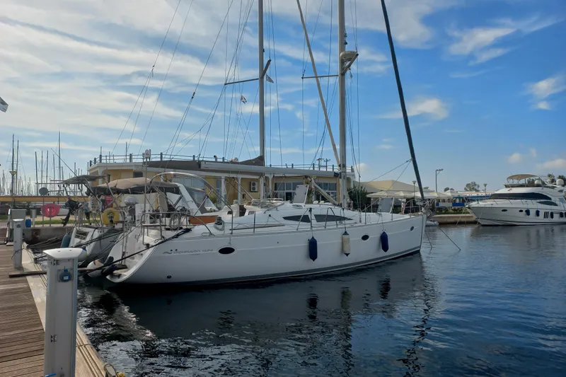  Yacht Photos Pics Sailboat Elan Impression 434, 2005 model, docked at marina under blue sky.