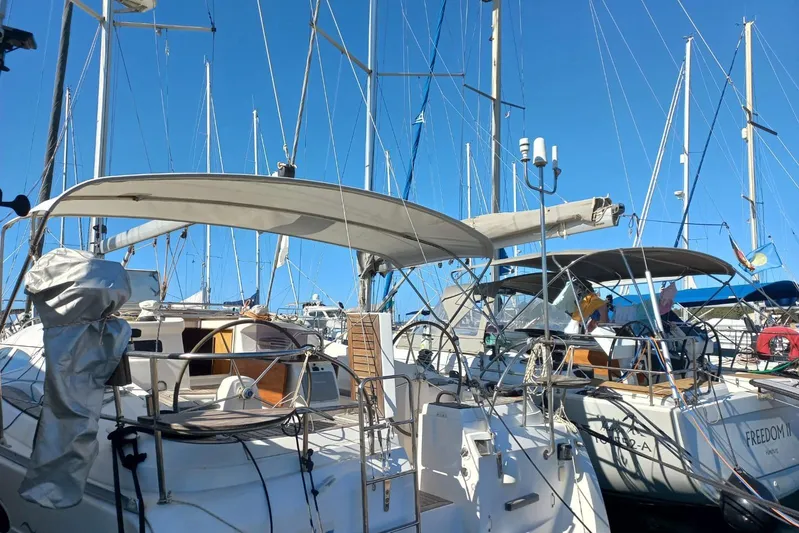  Yacht Photos Pics Sailboats docked at marina, featuring 2005 Elan Impression 434 under clear blue sky.