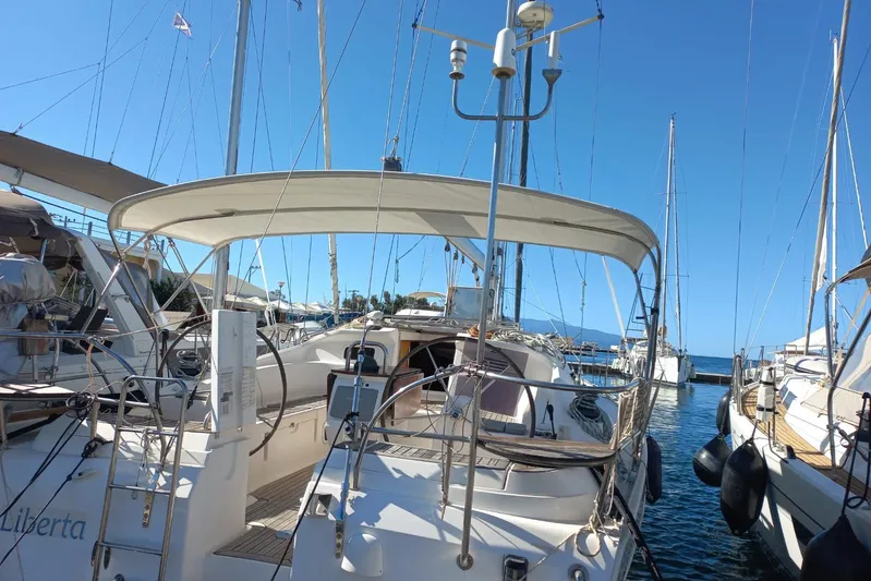  Yacht Photos Pics Sailboat Elan Impression 434, 2005 model, docked in a marina under clear blue skies.