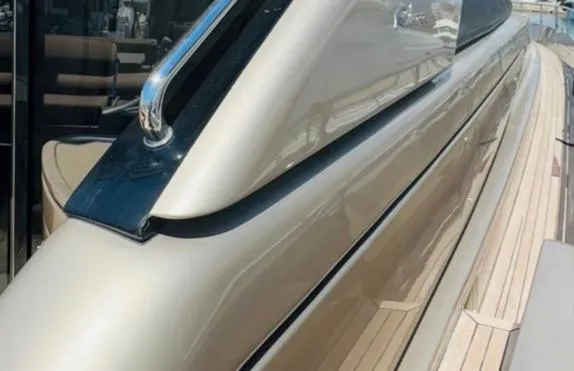  Yacht Photos Pics 2006 Riva 68 Ego yacht, sleek design with polished exterior and wooden deck details.