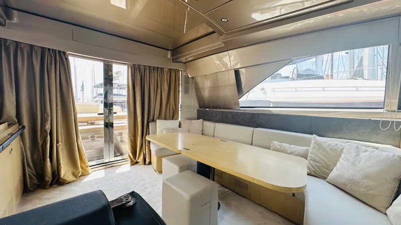  Yacht Photos Pics Luxurious interior of a 2006 Riva 68 Ego yacht with elegant seating and dining area.