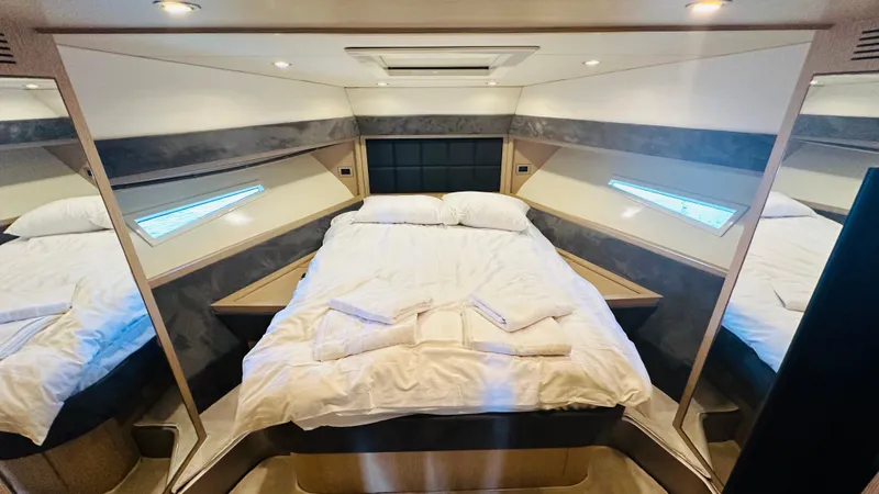  Yacht Photos Pics Luxurious bedroom interior of a 2006 Riva 68 Ego yacht with elegant bedding.