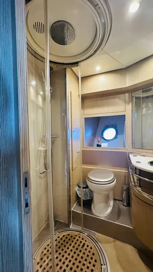  Yacht Photos Pics Luxurious bathroom in 2006 Riva 68 Ego yacht with shower and porthole.