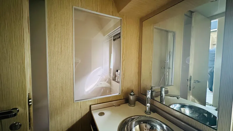  Yacht Photos Pics Luxurious bathroom interior of 2006 Riva 68 Ego yacht with modern fixtures.