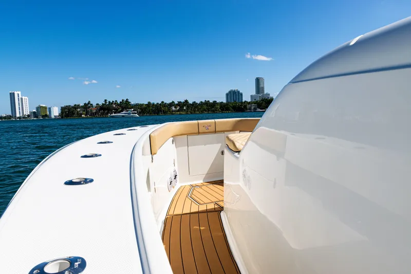  Yacht Photos Pics 2016 SeaVee 430 boat deck with city skyline and blue sky background.