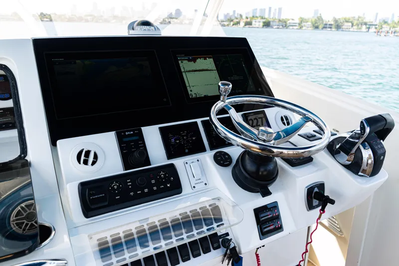  Yacht Photos Pics 2016 SeaVee 430 boat helm with advanced navigation controls and steering wheel.