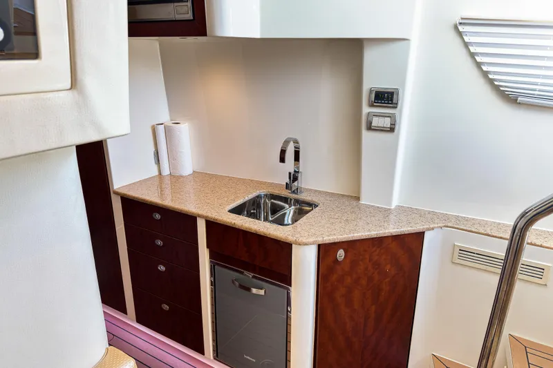  Yacht Photos Pics Luxurious 2016 SeaVee 430 yacht interior with modern kitchenette and sleek design.