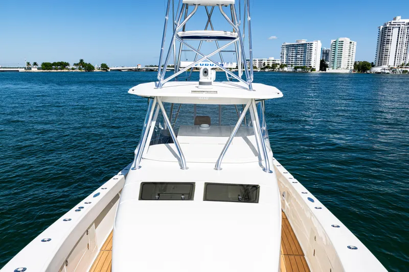  Yacht Photos Pics 2016 SeaVee 430 boat on water with city skyline in background.