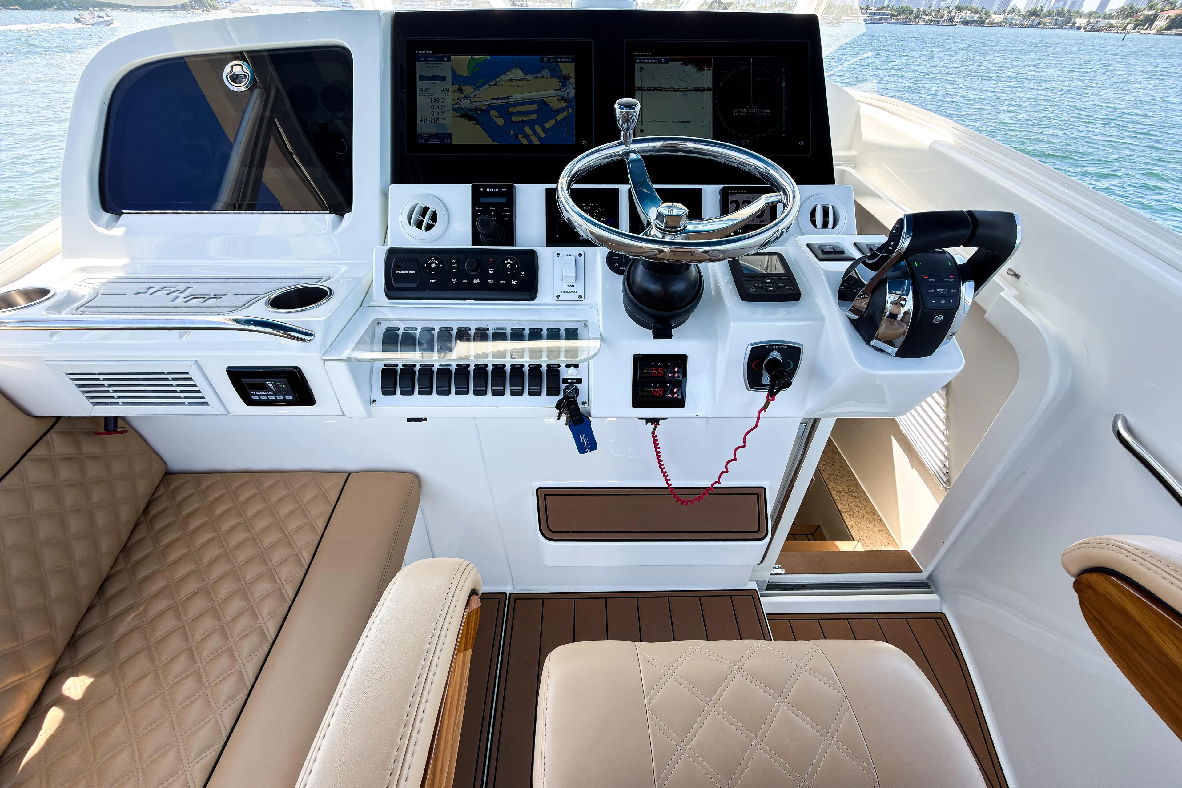  Yacht Photos Pics 2016 SeaVee 430 boat helm with modern controls and navigation screens.