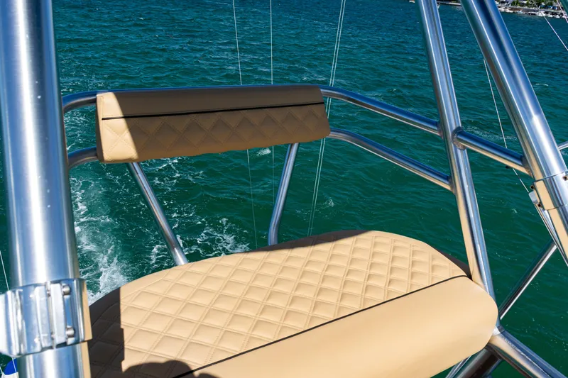  Yacht Photos Pics 2016 SeaVee 430 boat with tan cushioned seating and stainless steel frame on open water.