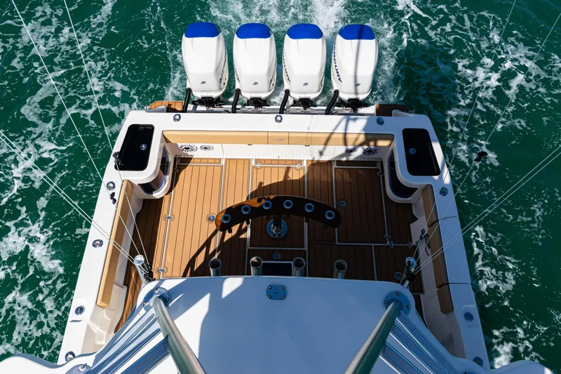  Yacht Photos Pics 2016 SeaVee 430 boat with four engines, teak deck, and fishing setup on open water.