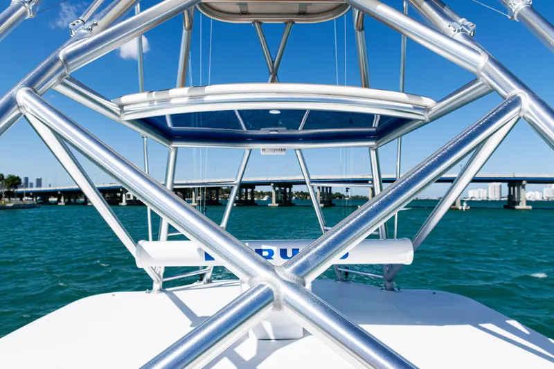  Yacht Photos Pics 2016 SeaVee 430 boat with metal framework, ocean view, and bridge in the background.