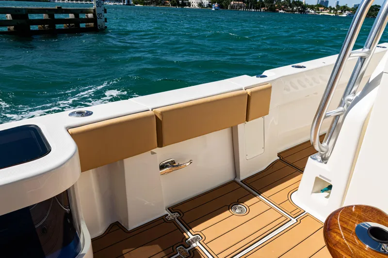  Yacht Photos Pics 2016 SeaVee 430 boat deck with cushioned seating and ocean view.