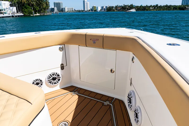  Yacht Photos Pics 2016 SeaVee 430 boat interior with tan seating, speakers, and ocean view.