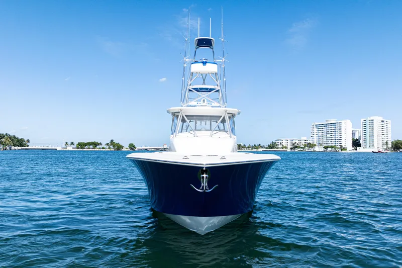  Yacht Photos Pics 2016 SeaVee 430 boat on blue water with cityscape background.
