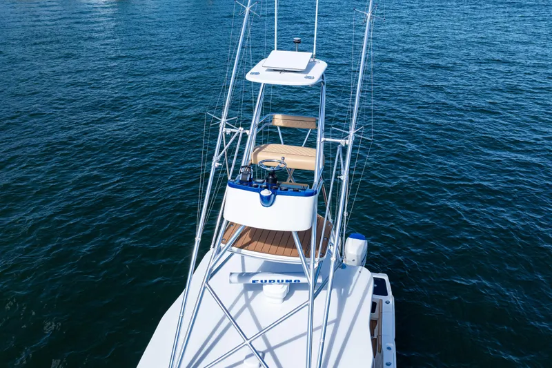 Yacht Photos Pics 2016 SeaVee 430 boat on water, featuring a tower and fishing equipment.