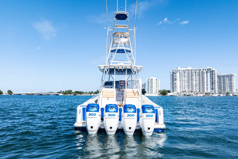  Yacht Photos Pics 2016 SeaVee 430 boat with four 300 horsepower engines on water, cityscape background.