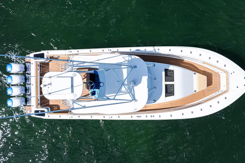  Yacht Photos Pics Aerial view of 2016 SeaVee 430 boat with four engines on green water.