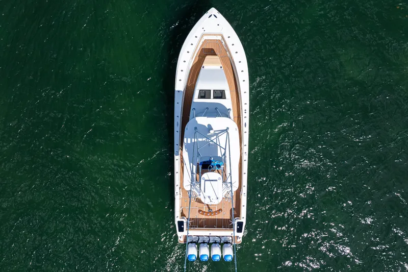  Yacht Photos Pics Aerial view of 2016 SeaVee 430 boat on green water.