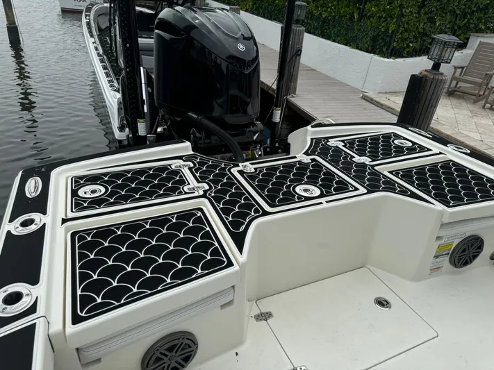  Yacht Photos Pics 2024 Pathfinder 2500 Hybrid boat with stylish deck design and powerful outboard motor.