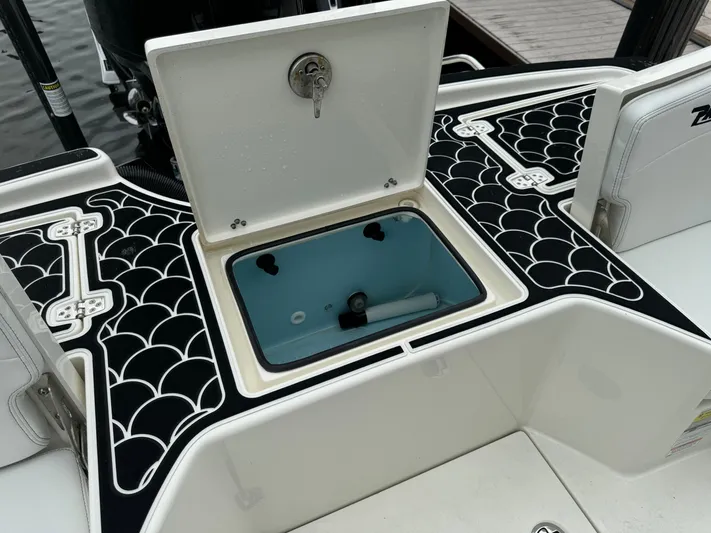  Yacht Photos Pics 2024 Pathfinder 2500 Hybrid boat with open storage compartment and stylish deck design.