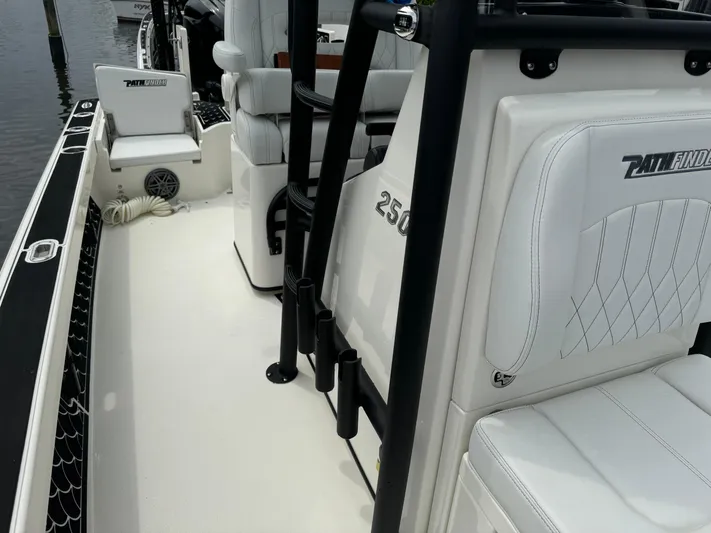  Yacht Photos Pics 2024 Pathfinder 2500 Hybrid boat interior with white seating and sleek design.