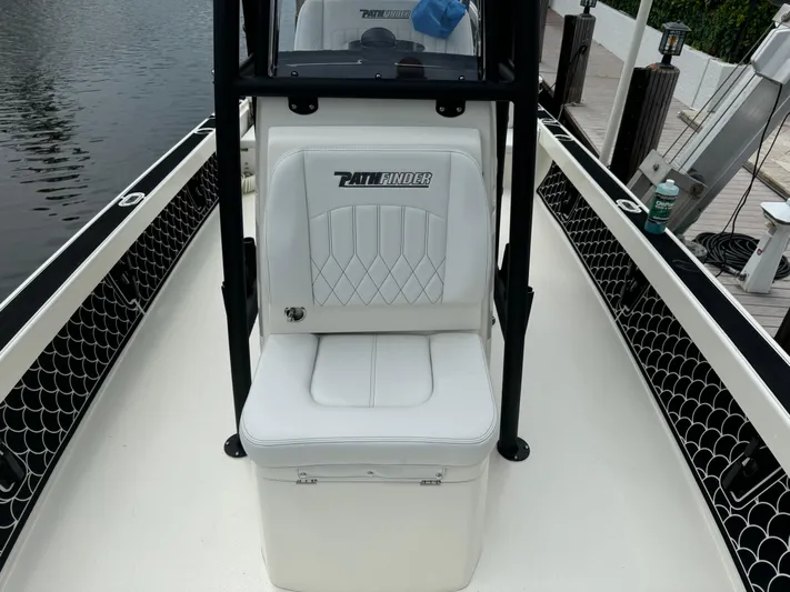  Yacht Photos Pics 2024 Pathfinder 2500 Hybrid boat interior with white seating and black accents.