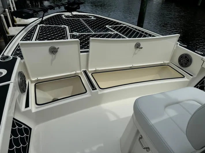  Yacht Photos Pics 2024 Pathfinder 2500 Hybrid boat with open storage compartments on deck.