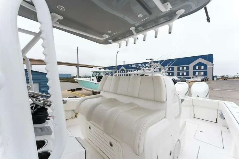  Yacht Photos Pics 2019 Invincible 39 Open Fisherman boat with cushioned seating and fishing rod holders.