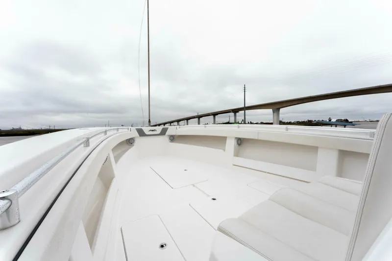  Yacht Photos Pics 2019 Invincible 39 Open Fisherman boat, spacious deck, overcast sky, bridge in background.