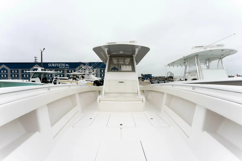  Yacht Photos Pics 2019 Invincible 39 Open Fisherman boat at marina, showcasing spacious deck and modern design.