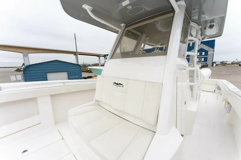  Yacht Photos Pics 2019 Invincible 39 Open Fisherman boat with white seating and console, dockside view.
