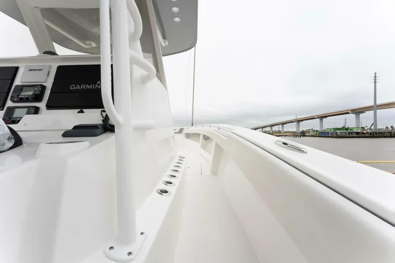  Yacht Photos Pics 2019 Invincible 39 Open Fisherman boat deck with modern controls and sleek design.